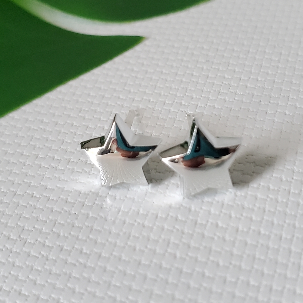 Star Hypoallergenic Plastic Tiny Studs Earrings - Picture 1 of 3